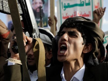 A Houthi supporter shouts slogans during an Anti- U.S and Israel rally in Sanaa, Yemen, Fr