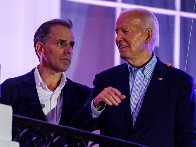 WASHINGTON, DC - JULY 4: President Joe Biden talks to his son, Hunter Biden, following the