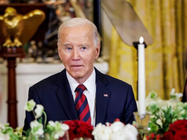 US President Joe Biden at a "Christmas Dinner for All" in the East Room of the White House