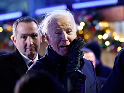 WASHINGTON, DC - DECEMBER 05: U.S. President Joe Biden yells out to the press while depart