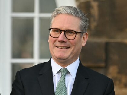 (L-R) Scotland's First Minister John Swinney, Britain's Prime Minister Keir Starmer and Wa