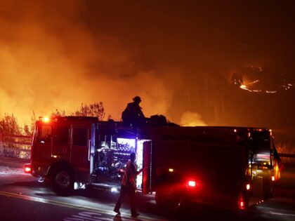 MALIBU, CALIFORNIA - DECEMBER 10: Firefighters work as the Franklin Fire burns on December