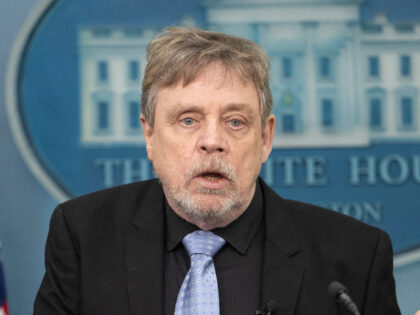 (L-R) White House Press Secretary Karine Jean-Pierre looks on as US actor Mark Hamill spea