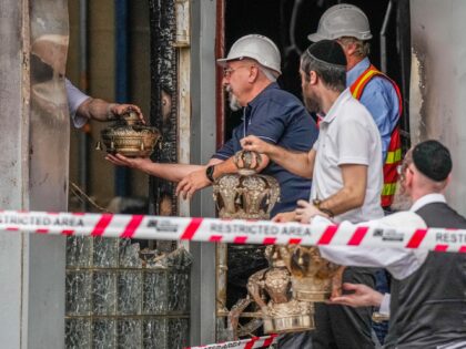 MELBOURNE, AUSTRALIA - DECEMBER 06: Members of the Synagogue recover items from the Adass