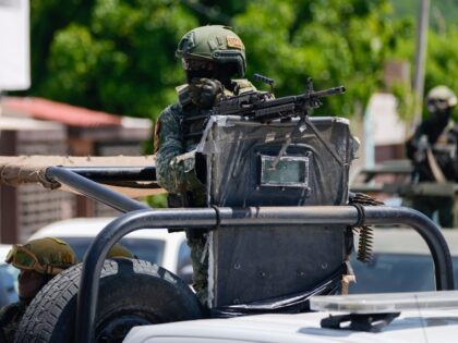 National Guard and Army forces patrol during an operation in a neighborhood of Culiacan, S