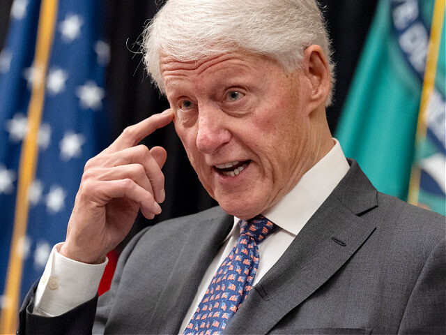 Former President Bill Clinton speaks in the Cash Room of the Treasury Department during an