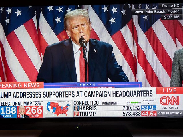 Former President Donald Trump speaks in front of supporters at his champagne headquarters.