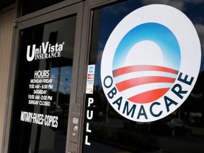 An Obamacare logo is shown on the door of the UniVista Insurance agency in Miami, Florida