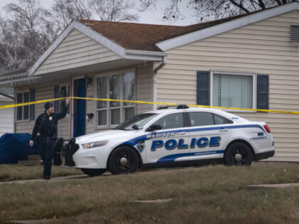 MADISON, WISCONSIN - DECEMBER 17: Police stand guard outside the home of 15-year-old Natal