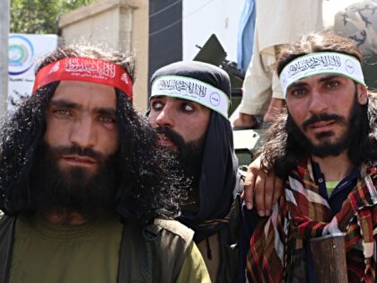 KABUL, AFGHANISTAN - AUGUST 15: Afghan people holding flags celebrate on the 2nd anniversa