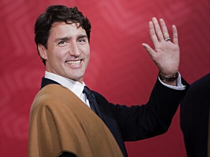 Canada's Prime Minister Justin Trudeau waves during the traditional "family photo" on the