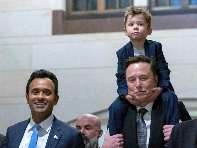 Speaker of the House Mike Johnson, R-La., from left, walks with Vivek Ramaswamy and Elon M