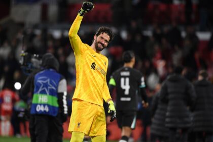 Alisson Becker (centre) kept a clean sheet on his return from injury