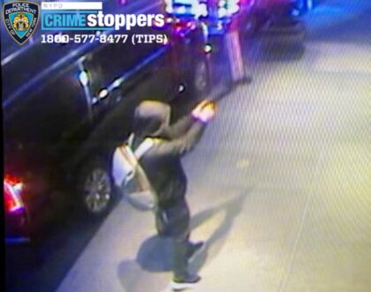 An unidentified hooded suspect draws a handgun, firing several shots at 50-year-old Thomps