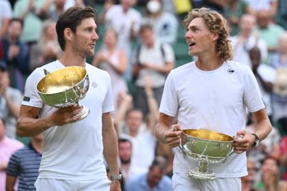 Australia's Max Purcell (right) celebrates winning the Wimbledon men's doubles title in 20