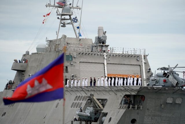 Crew members of the USS Savannah line up as they prepared to dock in Cambodia's port city