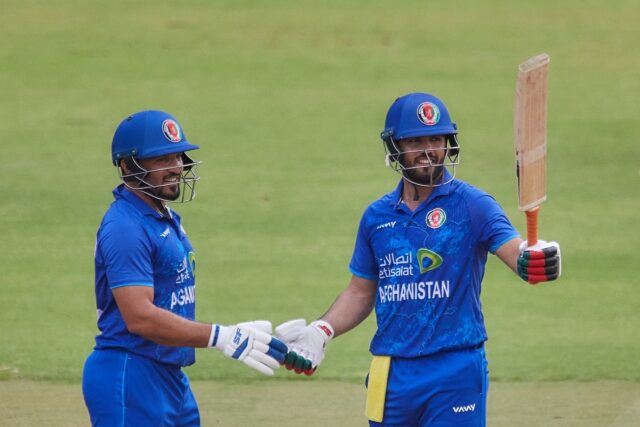 Darwish Rasooli (R) celebrates with Gulbadin Naib after scoring his first fifty for Afghan