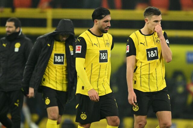 Disappointed Dortmund players leave the field after Sunday's 1-1 draw at home against Hoff