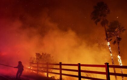 A firefighter battles the Franklin blaze in Malibu, California on December 10, 2024