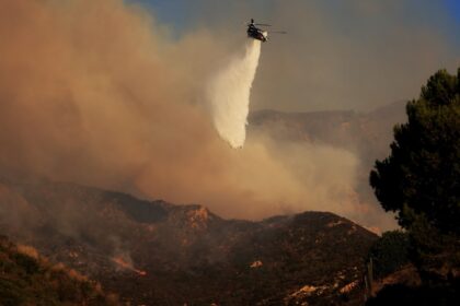 Firefighters are tackling the blaze in Malibu from the air and from the ground, but on Tue