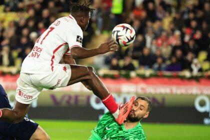 Gianluigi Donnarumma sustains an injury in a challenge with Wilfried Singo (L)