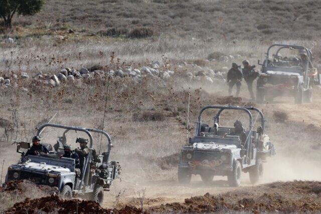 Israeli troops deploy inside the UN-patrolled buffer zone that is supposed to separate Isr