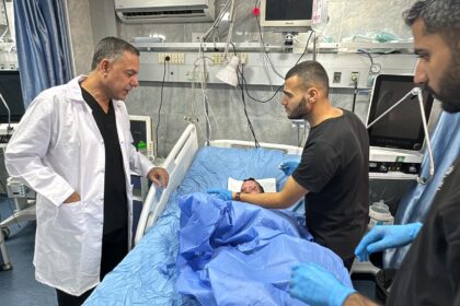 Kamal Adwan hospital chief, Hossam Abu Safiyeh, checking an injured child on October 24, 2