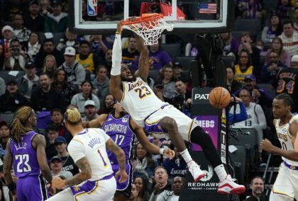 Los Angeles Lakers star LeBron James throws down a dunk in an NBA game against the Sacrame