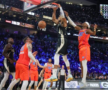 Milwaukee's Giannis Antetokounmpo, dunking the ball, and Oklahoma City's Shai Gilgeous-Ale