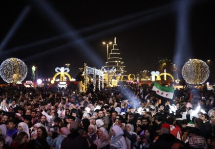 People celebrate the New Year near Umayyad Square in Damascus, Syria