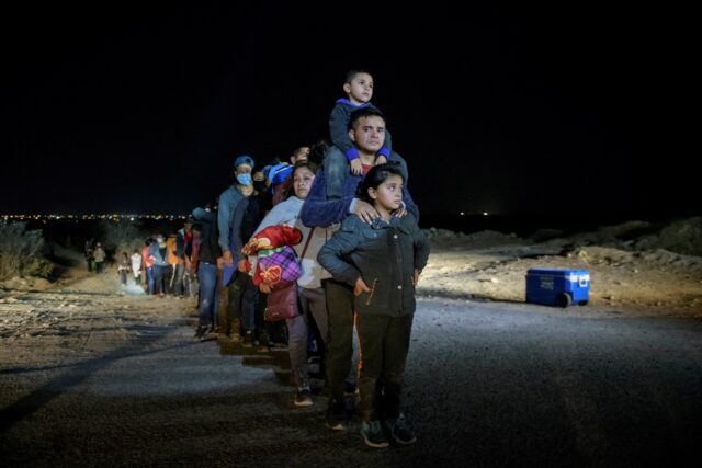 In a photo taken on March 27, 2021 a family of immigrants, who arrived illegally across th