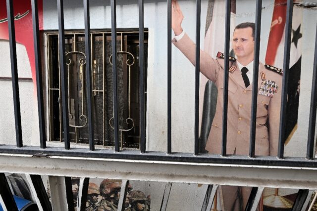 A portrait of toppled Syrian president Bashar al-Assad at the Baath party offices in Damas