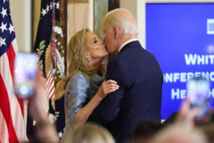 US President Joe Biden and First Lady Jill Biden embrace during the first-ever White House