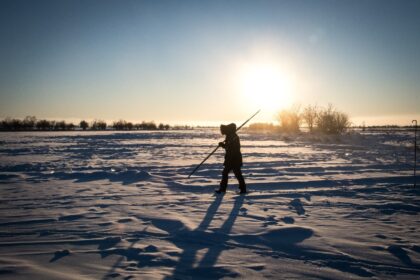 Villagers harvest ice from a local lake near the settlement of Oy, some 70 km south of Yak