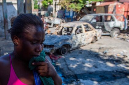 A woman cries after armed gangs shot her husband dead in Port-au-Prince, Haiti