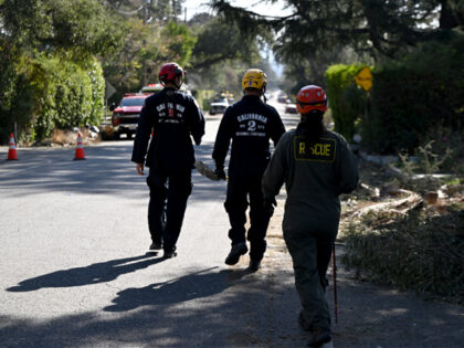 LOS ANGELES, CA - JANUARY 13: Cal Fire and LA Sheriff department's search and rescue team