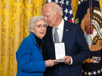 President Joe Biden awards the Presidential Citizens Medal to Eleanor Smeal during a cerem