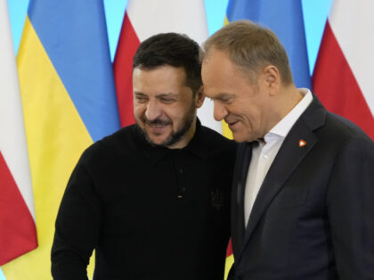 Polish Prime Minister Donald Tusk, right, welcomes Ukrainian President Volodymyr Zelenskyy