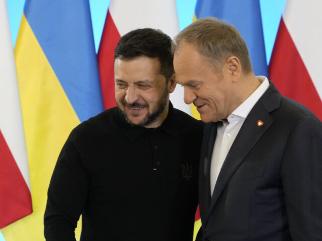 Polish Prime Minister Donald Tusk, right, welcomes Ukrainian President Volodymyr Zelenskyy