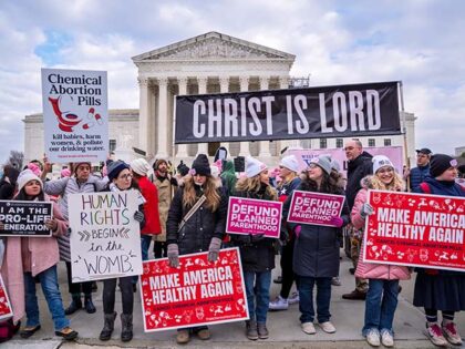 Anti-abortion activists walk past the Supreme Court in the annual March for Life, in Washi