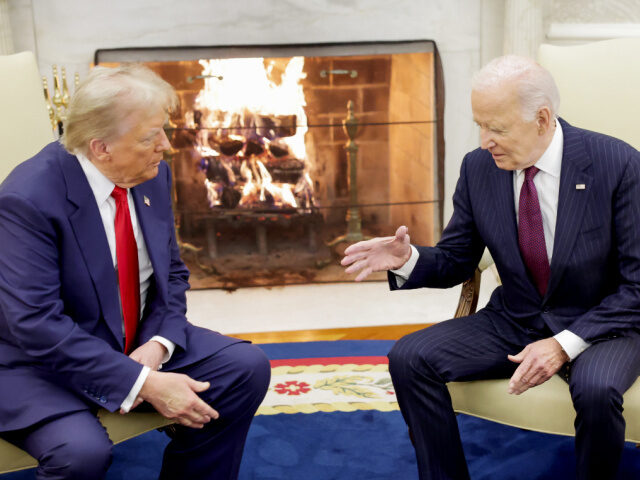 WASHINGTON, DC - NOVEMBER 13: U.S. President Joe Biden shakes hands with U.S. President-el