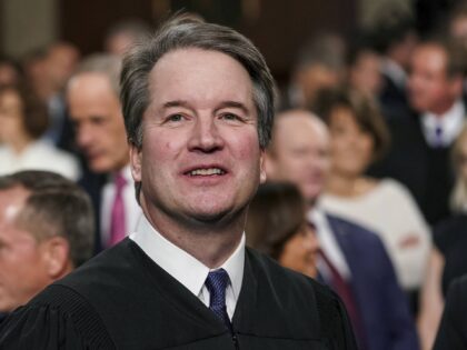 FILE - Supreme Court Associate Justice Brett Kavanaugh watches as President Donald Trump a