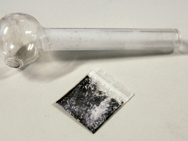 A pouch containing crystalized methamphetamine and a homemade pipe are shown March 21, 200