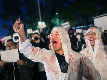 Los Angeles, California November 29, 2022-Lijian Jie yells in protest during a candlelight