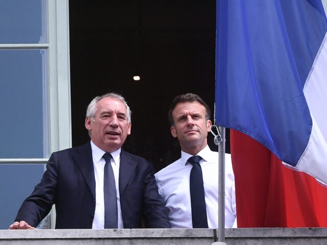 French President Emmanuel Macron (R) poses with Pau's mayor Francois Bayrou (L) on the bal