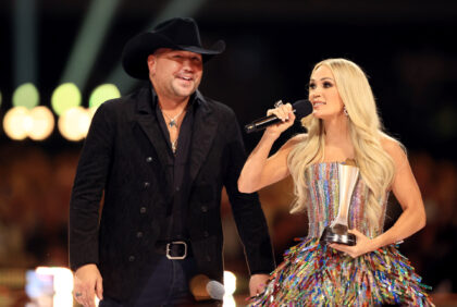 Jason Aldean and Carrie Underwood speak onstage at the Academy of Country Music Awards hel