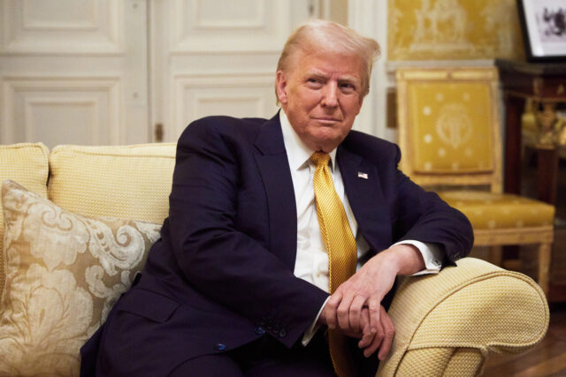 PARIS, FRANCE - DECEMBER 7: President-Elect Donald Trump reacts during his meeting with P