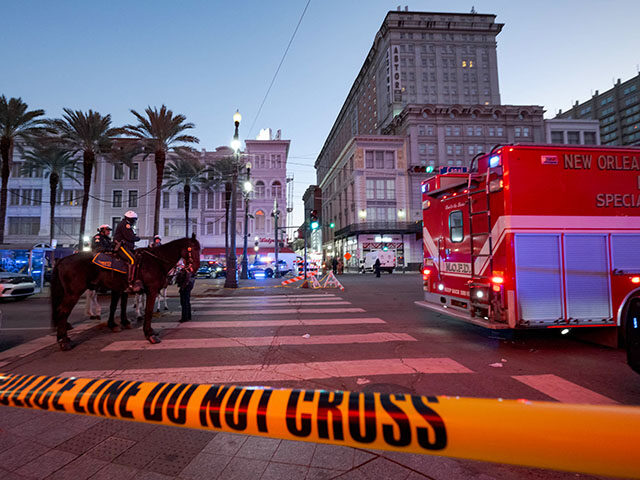 Police cordon off the intersection of Canal Street and Bourbon Street in the French Quarte