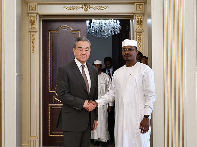 Chadian President Mahamat Idriss Deby Itno R, Front shakes hands with Chinese Foreign Mini