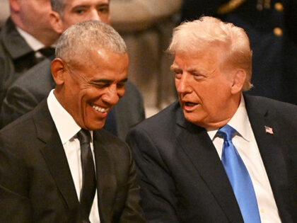 Former US President Barack Obama speaks with President-elect Donald Trump before the State